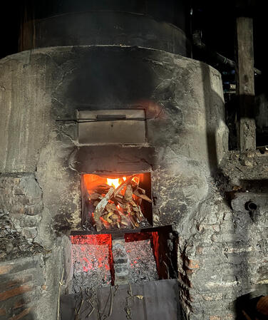 Traditional distillation process with firewood